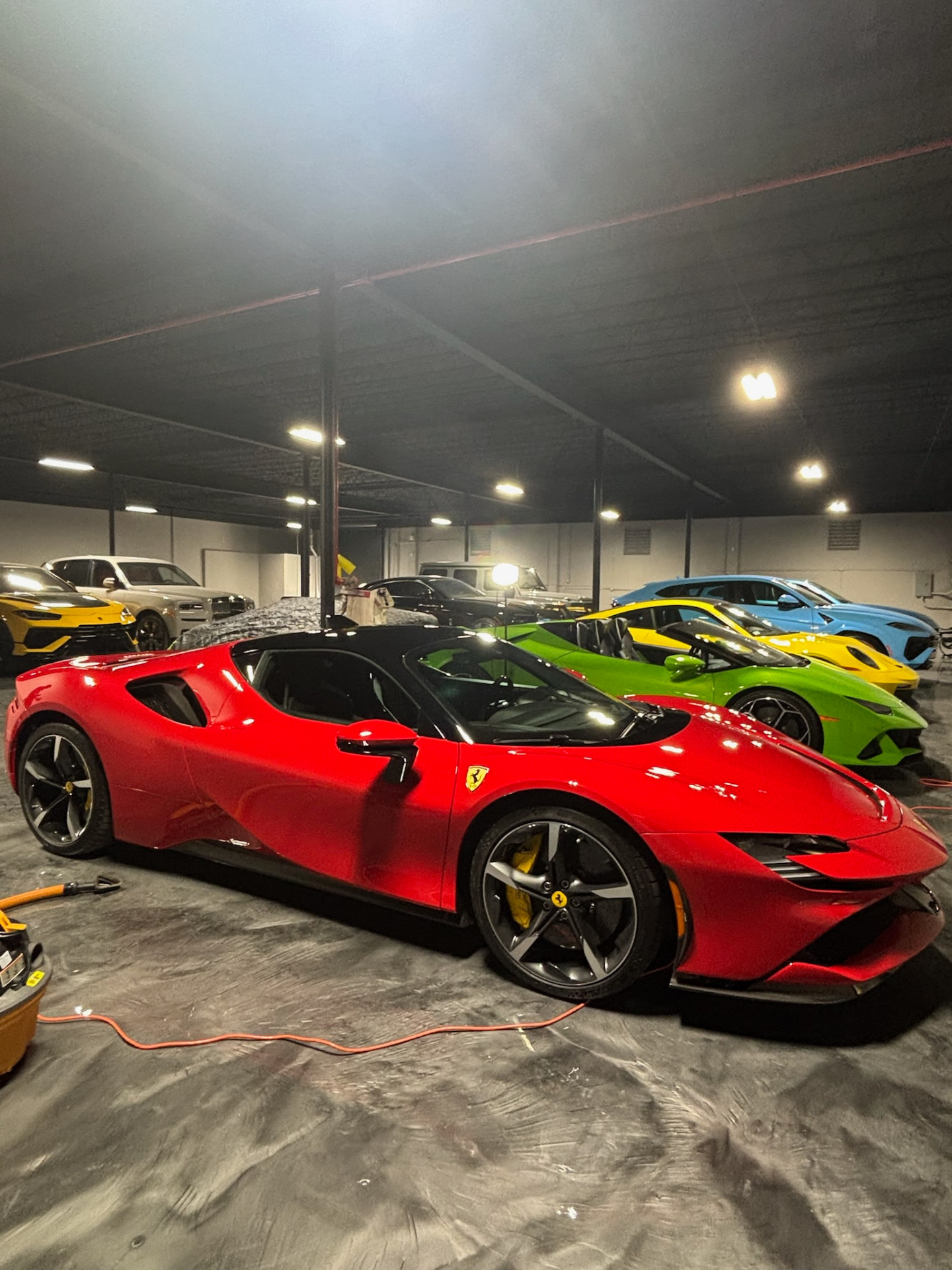 FG Car Wash Miami shop with exotic car lineup